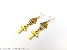 Mini Ankh Earrings - Ankh Symbols (2cmx1.3cm) - Hamsa Symbols. - 4cm total earrings length. - Earhooks in various material : Chose from dropdown box. - Gold colour. - Handmade. - Comes in a pair. Fast Worldwide Shipping More jewellery, accesoires, altar equipment and much more can be found at www.luciferothica.com © Luciferothica.com All Rights Reserved. Adjustable Brass Cross Jewelry, Adjustable Brass Cross-shaped Jewelry, Gothic Gold Brass Jewelry, Gold Spiritual Plug Earrings, Adjustable Gold Jewelry For Halloween, Ankh Earrings Jewelry As A Gift, Ankh Earrings For Pierced Ears Gift, Ankh-shaped Earrings For Pierced Ears As Gift, Symbolic Gold Plug Earrings As Gifts