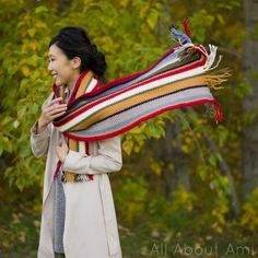 a woman holding a scarf in her hands