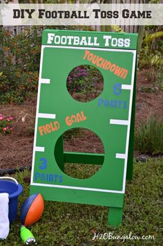 a diy football toss game in the grass with toys around it and text overlay that reads diy football toss game