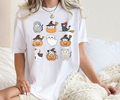 🎃Cat Lover Tshirt, Kawaii Cat, Fall Shirt, Ghost Shirt, Retro Halloween Shirt, Coquette Halloween Shirt. 👕Unisex T-shirt - 100% Airlume combed and ringspun cotton - Soft cotton and quality print make users fall in love with it over and over again. - These t-shirts have-ribbed knit collars to bolster shaping. - Printed and shipped from the USA 👉CARE INSTRUCTIONS - Wash inside out with like colors. - Tumble dry or hang to dry. - Try not to iron directly over the design. Iron if necessary! HOW TO ORDER 📦 1) Please, check and review all photos. 2) Choose your sweatshirt or t-shirt style, color, and size. (If you want to dress comfortably like the model in the photo. Please buy 1 to 2 sizes up from what you usually wear.) 3) Click add to cart. You can go back and follow the same steps to ad White Cat Print T-shirt For Halloween, White T-shirt With Cat Print For Fall, Halloween White T-shirt With Cat Print, White Cat Print T-shirt For Fall, White T-shirt With Cat Design For Fall, Coquette Halloween, Shirt Coquette, Cricut Shirts, Pumpkin Cat