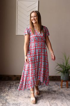 Introducing our Red V-Neck Floral Maxi Dress - a fun, cheerful dress perfect for all your summer adventures. Made with a lightweight fabric and a convenient snap closure on the v-neck, it's also a great option for nursing moms! Dress it up or down for any occasion. The Fit of This Boutique Hi-Low Maxi Dress: Pictured of a typical Small Top wearing the Small. See HOW TO MEASURE Here. TOP: Flat Across Measurements in Inches Size: Chest Across Waist Across Length Small 15 23 43 front/52 back Medium Maxi Dress Classy, Casual Floral Print Maxi V-neck Dress, Casual V-neck Rayon Maxi Dress, Summer Skirt Outfits, Red Printed V-neck Maxi Dress, V-neck Rayon Maxi Dress With Floral Print, Dress Everyday, Style For Spring, Classy Closets