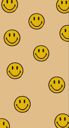 many yellow smiley faces on a tan background