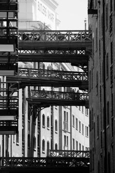 black and white photograph of an old building in the city