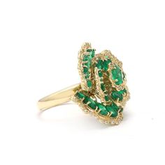 This is part of Chairish’s Fine Jewelry assortment.  Emerald flower ring in 14K gold which perfectly goes with your personality and also helps you to improve your creativity. Featuring 5.82 cts of emerald with diamonds that makes it a perfect fit to wear it on your wedding or style it with any of your basic outfit to give it a glam.  PRODUCT DETAILS :-  Material - 14K Solid Yellow Gold Gemstone - Emerald Gemstone Weight - 5.82 ct Stone Shape - Oval  Stone Size - 4 x 3 mm Diamond Weight - 0.31 ct Elegant Green Flower Ring For Formal Occasions, Elegant Green Emerald Flower Ring, Elegant Green Oval Flower Ring, Oval Stone, Emerald Gemstone, Flower Ring, Basic Outfits, Emerald, Perfect Fit