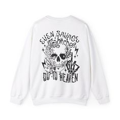 🎉 Introducing our Savage B*tches Sweatshirt, a bold and fearless statement piece that's sure to turn heads. This sweatshirt features a rebellious skull illustration on the front chest side pocket area, with the skull's hand making a daring middle finger gesture 🖕, setting the tone for your unapologetic style. 🔥 Crafted with comfort in mind, our sweatshirt ensures both warmth and style with its high-quality materials and relaxed fit. The front pocket area adds a subtle yet edgy detail, perfect for showcasing your attitude. 💀 But the real attitude comes alive on the back of the sweatshirt, where you'll find another skull head and hand making a bold middle finger gesture, accompanied by the defiant message, "Even Savage b*tches go to heaven." This powerful combination of imagery and text Halloween Graphic Print Sweatshirt For Streetwear, Halloween Skull Print Sweatshirt For Streetwear, Punk Sweatshirt With Skull Print For Streetwear, Urban Halloween Sweatshirt With Graphic Print, Punk Skull Print Sweatshirt For Streetwear, Oversized Punk Sweatshirt With Letter Print, Urban Skull Print Crew Neck Top, Urban Style Halloween Graphic Sweatshirt, Band Merch Sweatshirt With Skull Print For Streetwear