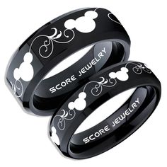 three black rings with mickey mouse designs on them