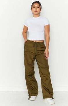 Our Frankie Parachute Pants are just the item your wardrobe needs! With endless styling options these on trend pants will be your daily go-to. Whether its a street look paired with a crop and sunnies or dress up with a corset and heels. These cargos also feature an adjustable tie waist and ankle cuff, style flared or gathered around the ankle to switch it up! High-waisted Cargo Style Parachute Pants, Versatile High Waist Parachute Pants With Relaxed Fit, Spring Straight Leg Parachute Pants Cargo Style, Straight Leg Cargo Parachute Pants For Spring, Spring Cargo Style Parachute Pants, Spring Utility High-waisted Parachute Pants, Trendy Solid Straight Leg Parachute Pants, Spring High-waisted Utility Parachute Pants, Fitted Wide-leg Cargo Pants In Casual Style