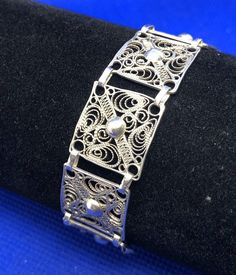 * Vintage 925 Sterling Silver Beaded Filigree Delicate Square Panel Bracelet * Length: 7-1/2" * Width: 5/8" * Weight: 9.3g * Closure: Spring ring * Marked: STERLING * 925 * Condition: As pictured. * S5469    Exported By ExportYourStore :) Classic Adjustable Bracelet With Intricate Design, Classic Engraved Sterling Silver Bracelet, Classic Adjustable Sterling Silver Bracelet With Intricate Design, Ornate Sterling Silver Bracelets, Ornate Sterling Silver Bracelets With Silver Clasp, Classic Sterling Silver Bracelet With Intricate Design For Wedding, Elegant Engraved Silver Beaded Bracelets, Elegant Silver Engraved Beaded Bracelets, Ornate Adjustable Sterling Silver Bracelet Hallmarked