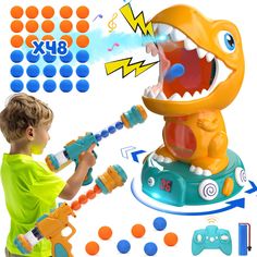 a young boy playing with an interactive toy dinosaur that looks like he's trying to blow out his teeth