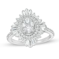 a white gold ring with an oval and baguetts set in the center, surrounded by small round diamonds