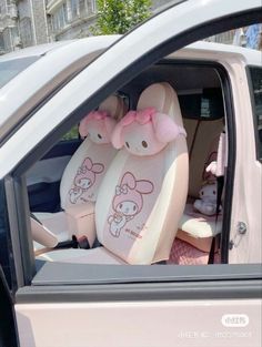 hello kitty car seat covers with pink bows on the front and back seats, set of two