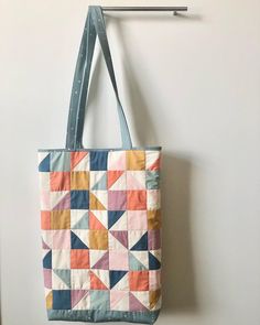 "You will love either of these roomy tote bags! They are perfect for carrying books, your laptop, kid toys & supplies - anything really!  They are generously sized to carry all your essentials and look fabulous at the same time!  Both totes feature an interior pocket so your smaller items are easy to find.   Hint: Tote bags make great gifts!! 2 options: Stripes: 17.5\" x 13\" x 2.5\" Squares/Triangles: 17\" x 10.5\" x 3\" Both totes are made with 100% quilters cotton in a variety of colors and are quilted and lined." Quilted Tote Bags, Quilted Totes, Kid Toys, Triangles, Bag Making, Modern Style, Tote Bags, Great Gifts, Stripes