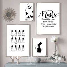 three black and white posters on the wall above a dresser with flowers in vases