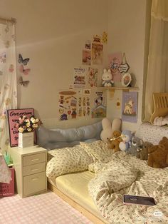 a child's bedroom with teddy bears on the bed