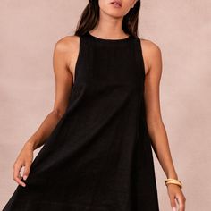 Chic A-line Linen Dress For Vacation, Black High Neck Mini Dress For Summer, Linen A-line Mini Dress For Beach, Black Linen Dress For Day Out, Chic Black Linen Dress For The Beach, Chic Black Linen Beach Dress, Chic Linen Mini Dress For Beach, Chic High Neck Beach Dress, Chic Black Linen Dress