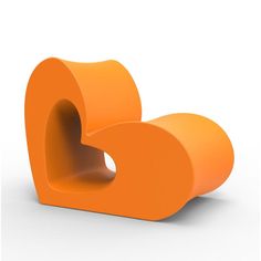 an orange heart shaped object on a white background