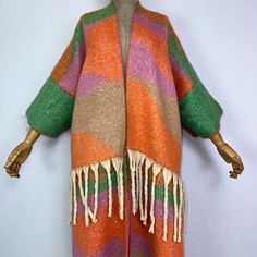 This super soft and warm wool cardigan kimono is perfect for the cold weather. Unlike other sweaters and wools, the wool used for this beauty is non itchy. Think of your favorite throw blanket, the comfort and warmth it gives but 10x stylish and wearable any where. This kimono is all that and more! One size fits S-4X Material: Wool One Size Fits Most Size Chart Trendy Wool Cardigan For Spring, Cozy Acrylic Sweater Coat For Fall, Bohemian Shawl For Fall Layering, Oversized Knit Acrylic Outerwear, Multicolor Soft Knit Cardigan For Fall, Fall Multicolor Soft Knit Cardigan, Long Multicolor Sweater For Fall, Multicolor Wool Long Sleeve Cardigan, Cozy One Size Shawl For Fall