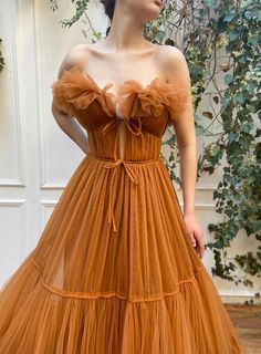 Details:-Tulle fabric-Cadmium orange colour-A-line tiered dress with waist definition-For special occasions Orange Prom Dress Long, Goddess Prom Dress, Western Dresses For Girl, Teuta Matoshi, Orange Prom Dresses, Frilly Dress, Georgina Rodriguez, Orange Dresses, Dress Design Sketches