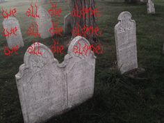 an old cemetery with tombstones and red writing on the headstones that read, we are all alone