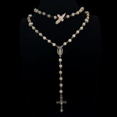 Follow @cherubtrove on Instagram for latest products and more information. ꣑ৎ Handmade goth cross necklace with glass pearls, baroque freshwater pearls, silver details & a silver cross charm. Adjustable length. Introducing our stunning silver cross necklace, a perfect blend of style and spirituality. This handmade necklace features a unique design that captures the essence of y2k grunge jewelry, making it an ideal accessory for anyone looking to express their individuality. With its gorgeous white pearl rosary and intricate silver cross pendant, this gothic rosary can not only be a religious necklace but also a fashionable piece of art. Whether you're layering it with other punk necklaces or wearing it alone, this one-of-a-kind pearl cross necklace will elevate your style. Beautiful silver Gothic Rosary, Goth Cross, Pearl Cross Necklace, Necklace Y2k, Grunge Jewelry, Silver Cross Necklace, Pearl Rosary, Silver Cross Pendant, Cross Charms