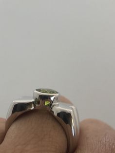 Rich bright Peridot green ring Sterling silver Tarnished with age, can be polished up. Size 7 can be sized by my jeweler. His service charge is $10-$20 All rings are shipped free in the US in a nice gift box. Check out our over a THOUSAND great reviews Engraving is $4 per letter and is not always perfect depending on the piece. It can take a few days if the jeweler is busy. This is payable to Paypal Judithsltd@gmail.com Lime Green Sterling Silver Promise Ring, Lime Green Sterling Silver Rings As Gift, Lime Green Sterling Silver Rings For Gift, Formal Green Sterling Silver Rings, Modern Green Round Cut Jewelry, Green Sterling Silver Open Ring, Green Tsavorite Rings With Bezel Setting, Modern Green Jewelry For Anniversary, Round Peridot Jewelry With Polished Finish