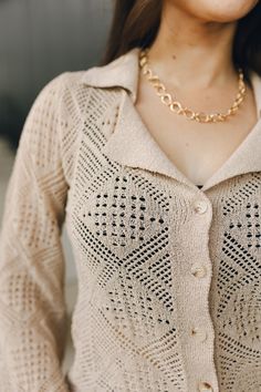 Embrace bohemian charm with the Stephanie Beige Crochet Top. This top features a delicate crochet design, a classic button-up front, and a stylish collar. The long bell sleeves with slits add a touch of flair and movement, making it a perfect piece for both casual and dressier occasions. Whether paired with jeans or layered over a dress, the Stephanie Beige Crochet Top brings effortless style to your wardrobe.