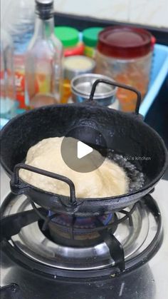 a skillet filled with flour on top of a stove