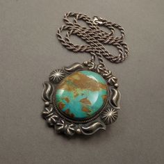 "See More Vintage Native American Jewelry here: https://www.etsy.com/shop/YearsAfter?section_id=13095973 A Spectacular Vintage Native American Navajo Turquoise Necklace Pendant Brooch handmade by Legendary Navajo Artist Kirk Smith (1957-2012) in Sterling Silver with a Thick Gorgeous Slab of Natural Pilot Mountain Turquoise in a Green Blue Color with a Chocolate Brown Matrix on 22\" Vintage Sterling Rope Chain, All Tested and Guaranteed Sterling, Early KS Sterling Hallmark, Shepard's Hook Hidden Western Turquoise Jewelry With Patina, Vintage Untreated Turquoise Necklace, Untreated Vintage Turquoise Necklace, Untreated Western Style Jewelry For Gifts, Bohemian Patina Necklaces Collectible, Southwestern Turquoise Necklace With Oxidized Finish, Southwestern Turquoise Necklace With Patina, Southwestern Untreated Turquoise Collectible Necklace, Southwestern Untreated Turquoise Necklace