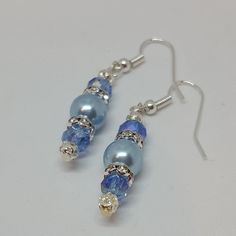 "Blue Pearl Drop Earrings, Wedding Earrings Fashion earrings made with flair and finesse. They are very lightweight, hypoallergenic, and catch the eye easily. The photos just do not do them justice! They measure 1 1/2\" inches from the top of the hook to the bottom metal dangle bead. Get something blue for your wedding jewelry in these authentic look blue pearl earrings that are simply elegant. They make unique gifts for any occasion and are perfect Mothers Day Jewelry as well. So whether you ar Classic Blue Pearl Earrings For Anniversary, Blue Hypoallergenic Earrings For Formal Occasions, Classic Blue Pearl Earrings For Wedding, Hypoallergenic Blue Jewelry For Wedding, Hypoallergenic Blue Wedding Jewelry, Nickel-free Blue Earrings For Wedding, Blue Pierced Earrings For Wedding, Pearl Drop Earrings Wedding, Blue Pearl Earrings