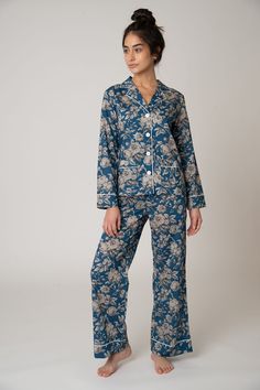 The Colony PJ Set is for comfort and fashion. The stylish wide-leg pant is complemented with the pull-on-and-go elastic waist. Make a statement with the whole look or break it up to make it your own. Style the shirt for day with jeans. Made with Liberty London Fabric. 100% cotton lawn Cold water wash / Hang dry Made in USA Model is 175cm/ 5'9" and is wearing a Small Colony Top Long sleeve 2 patch pockets 4 button front closure Colony Pant Wide-leg Side-seam pockets Elastic waist with drawstring Intentional Wardrobe, Best Pjs, Pj Day, Night Pajama, Bridesmaid Getting Ready, The Colony, Liberty London, Sleep Wear, Cotton Pajama Sets