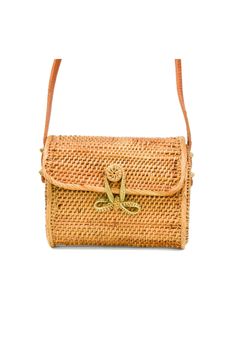 This is the sweetest mini-straw bag to complete a summertime look! The delicate bow closure and the careful woven details make this a truly special bag. Mini-messenger woven style with bow closure 6.5"W X 5.5"H X 3.25"D (*note - cannot fit an iPhone Plus size*) 100% Handwoven Rattan Fabric-lined interior Leather Strap Strap Drop: 15" Handmade by talented artisans Handmade Artisan Bags All of our rattan straw items are handwoven by individual artisans. Due to the fact that each rattan straw shoul Artisan Bag, Popular Handbags, Straw Handbags, Rattan Bag, Beaded Handbag, Sustainable Fashion Brands, Weave Style, Women Artisans, Handmade Artisan