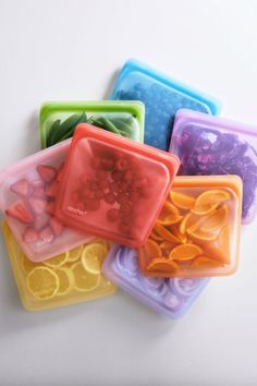 five square plastic trays with different designs on them