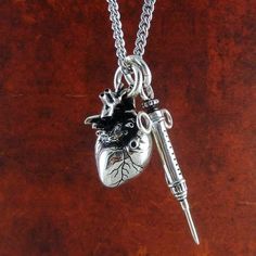 Heart & Syringe Necklace – Goth Mall Diamond Moon Necklace, Gothic Heart, Double Horn Necklace, Wallet Chains, Carved Heart, Horn Jewelry, Horn Necklace, Skull Necklace, 14k Gold Necklace