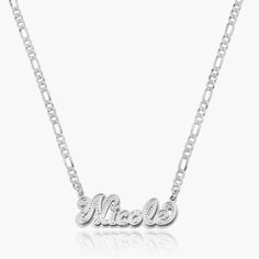 Our popular Double Plated Iced Out Script Name Necklace boasts a chic and elegant design, handcrafted to perfection. The model showcases the necklace with an 18-inch Cuban chain (see image for reference). Chain width:Cuban Chain - 3.7 mmFigaro Chain - 3 mmRope Chain - 2.3 mm Closure: All chains are fitted with a lobster clasp. Metal Selection: Gold Plated Silver Plated Sterling silver 14k gold plated over sterling silver 14k solid gold - (NAMEPLATE ONLY) Elegant Personalized Link Necklaces, Elegant Personalized Link Jewelry, White Gold Link Necklace For Gift, White Gold Link Necklace As Gift, Elegant Name Necklace With Chain For Gift, Anniversary Sterling Silver Link Necklaces, Sterling Silver Link Necklaces For Anniversary, Elegant Silver Necklace With Figaro Chain, Elegant Silver Figaro Chain Jewelry