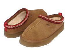 Ugg Tazz Kid /Women Slippers: Suede upper UGG Tasman braid (70% recycled polyester, 30% rayon) 10mm UGGplush 80% upcycled wool, 20% lyocell lining 10mm UGGplush 80% upcycled wool, 20% lyocell insole EVA outsole Textile binding made from 100% recycled polyester fibers 1.5" platform height Heat-embossed UGG logo All items can have a red mark on the size tag. It is to prevent item to be returned in the store and cash out for higher price. The red mark does affect on the quality or appearance of the Red Tasman Uggs, Tazz Ugg, Red Uggs, Burr Basket, Ugg Tazz, Kids Heels, Athletic Clothes, Ugg Tasman, Women Slippers