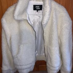 M White Fluffy Jacket, Warm And Cozy! Never Worn, No Tags Though. Chic White Fluffy Outerwear, Trendy Fluffy Long Sleeve Outerwear, Winter White Fluffy Long Sleeve Outerwear, Casual Cream Outerwear With Faux Fur Lining, Casual Fluffy Outerwear For Spring, Cozy White Outerwear With Faux Fur Lining, Trendy White Outerwear With Faux Fur Lining, Cozy Fluffy Long Sleeve Outerwear, White Fluffy Jacket