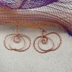 Handmade wire Halloween Pumpkin wire earrings Handmade Copper Earrings For Party, Pierced Dangle Earrings With Wire, Spiral Wire Earrings With Ear Wire, Spiral Wire Wrapped Earrings For Party, Copper Wrap Earrings As A Gift, Wire Wrapped Spiral Earrings For Parties, Party Spiral Wire Wrapped Earrings, Unique Nickel-free Wire Earrings, Rose Gold Wire Wrapped Earrings