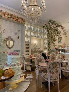 a room filled with lots of tables and chairs covered in cake sitting on top of them