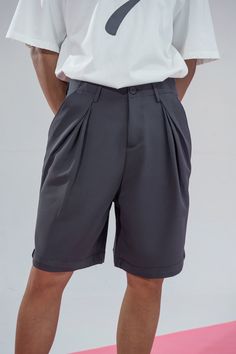 The Retro Pleated Pocket Shorts combine a vintage-inspired design with modern craftsmanship, creating a unique and stylish piece. These knee-length shorts feature distinctive pleating around the hips, adding texture and depth to the overall look. Equipped with pockets on both sides, they offer a practical yet fashionable touch. Crafted from premium fabric, these shorts provide a slightly oversized fit for a comfortable and contemporary style. Knee-length design Pleated detailing around the hips Solid Workwear Shorts With Pockets, Workwear Shorts With Hip Pockets For Spring, Solid Color Bermuda Shorts With Pockets, Solid Bermuda Shorts With Pockets, Workwear Shorts With Pockets, Spring Workwear Shorts With Hip Pockets, Workwear Pants With Pockets And Short Inseam, Spring Short Leg Pants With Welt Pockets, Workwear Bottoms With Side Pockets And Short Inseam