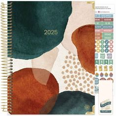 a spiral notebook with an abstract design on the front and back cover, featuring circles