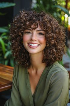 Embrace the beauty of curly hairstyles with this dynamic choppy layers look! Perfect for adding movement and texture, the choppy layers beautifully frame your face while enhancing the natural bounce of your curls. This hairstyle not only elevates your curls but also offers a playful vibe that’s ideal for any occasion. Discover how choppy layers can transform your curly hairstyles into a statement of style! Woman Curly Haircut, Curly Short Layered Haircuts, Short Hair With Curly Hair, Curly Hair Short With Bangs, Highlights For Curly Hair Natural Curls Brunettes, Short Curly Layered Haircuts, Face Framing Curly Haircut, Hair Color For Curly Hair Natural Curls, Curly Layered Bob With Bangs