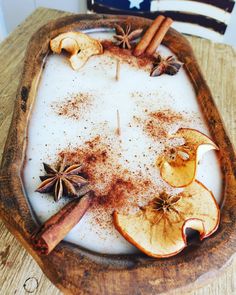 an apple slice with cinnamon and star anise on it