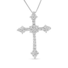 With sophistication and grace, this diamond cross pendant is a traditional symbol of your faith. Fashioned in 14K white gold, this beautiful look showcases a diamond-lined cross sparkling with a diamond composite at the center. Adding elegance, a trio of diamonds glistens at the end of each edge. All diamonds boast a color rank of I and clarity of I1. Radiant with 3/4 ct. t.w. of diamonds and a brilliant buffed luster, this pendant suspends along an 18.0-inch box chain that secures with a spring Diamond Cross Pendants, Diamond Cross, Cross Jewelry, Box Chain, Cute Jewelry, Spring Rings, Cross Pendant, Elegant Style, Types Of Metal