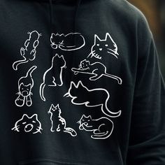 "Important Announcement!!  We will be overhauling our brand in the new year and many designs will be retired! Be sure to grab any favorites now before they are gone! Cats are so weird... This hoodie is screenprinted by hand with non-toxic ink on your choice of color unisex-style fleece hoodie. These are a super soft cotton/poly blend and feature a front pocket, double lined hood, and matching hood ties. ☆━......━☆ Sizing in Inches S - width 20\" - length 28\" M - width 22\" - length 29\" L - wid Black Hoodie With Cat Design, Casual Black Hoodie With Cat Print, Black Cat Print Hoodie For Winter, Black Hooded Hoodie With Cat Print, Black Hoodie With Cat Print, Black Hoodie With Cat Print For Winter, Weird Cats, Sharpie Doodles, So Weird