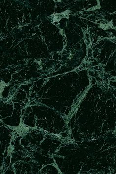 green marble textured with black and white streaks