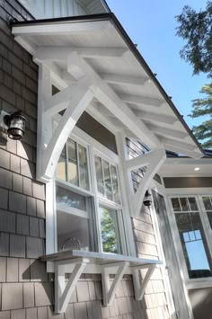 an outside view of a house with white trim