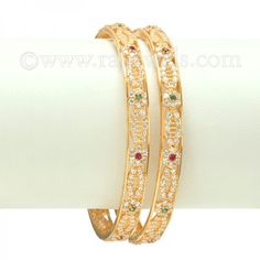 Ravishing #baby #bangles in 22 karat yellow gold with beautiful scroll of #cubiczirconia , studded with green and red color stones. - See more at: https://www.rajjewels.com/22k-scroll-cz-baby-bangle-s.html#sthash.54BQXDLN.dpuf Color Stones, Gifts Baby, Gold Bangle