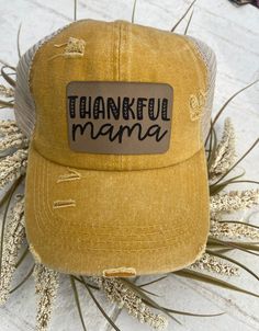 This is so cute for the fall season, or just in general! Distressed mustard yellow baseball cap with a criss cross pony tail back. Hat has a brown engraved patch permanently adhered. All hats ship safely in a brown box. Yellow Hat Outfit, Criss Cross Ponytail, Yellow Baseball Cap, Thankful Mama, Fall Apparel, Yellow Hat, Brown Box, Yellow Mustard, Outfits With Hats