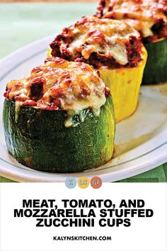 two stuffed zucchini cups with meat, tomato and mozzarella sauce