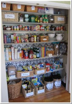 an organized pantry with baskets and food items